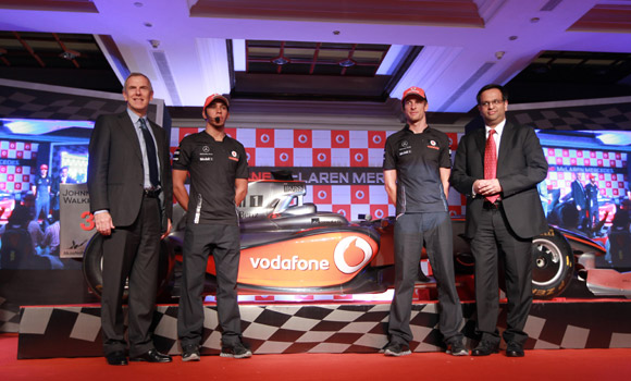 (L-R)Martin Pieters, Lewis Hamilton and Jenson Button with Mr. Shiv Agarwal winner of Vodafone Drive into the big league